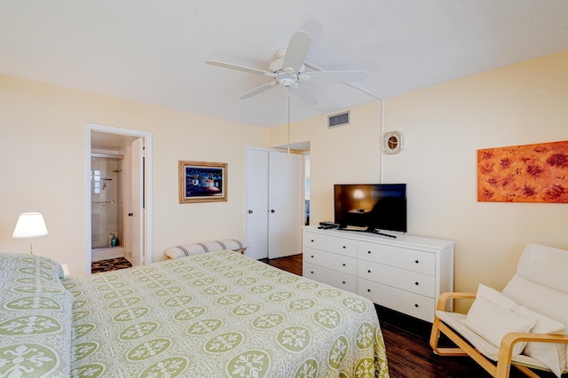 bedroom featuring ceiling fan, dark hardwood / wood-style flooring, and ensuite bathroom