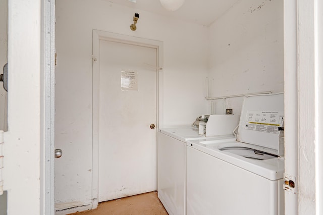 laundry room featuring washing machine and clothes dryer