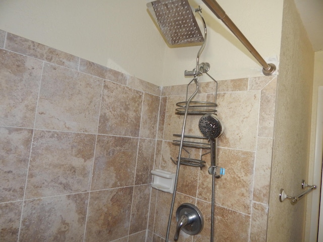 interior details with a tile shower