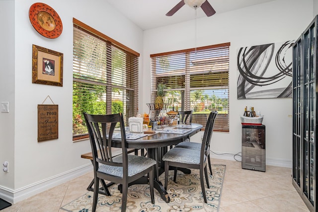 dining area featuring light tile patterned floors and ceiling fan