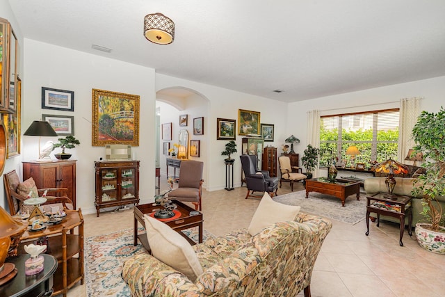 living room featuring light tile patterned floors and a textured ceiling