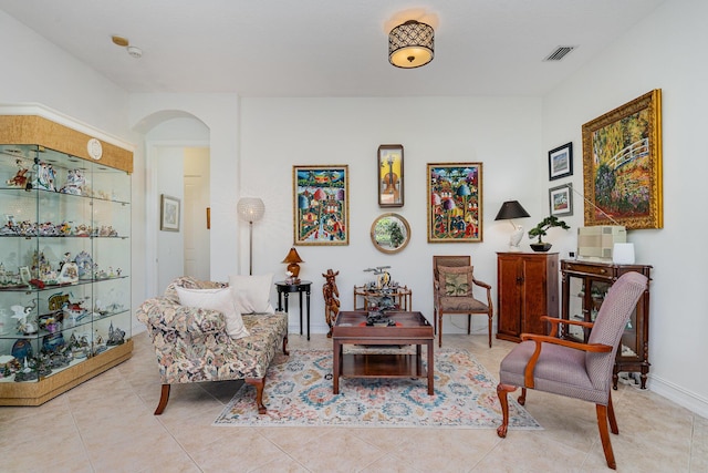 sitting room with light tile patterned floors