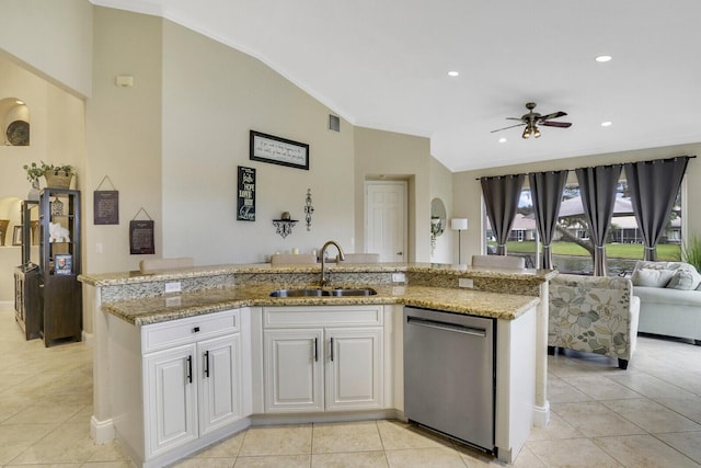 kitchen featuring a kitchen island with sink, stainless steel dishwasher, white cabinets, and sink