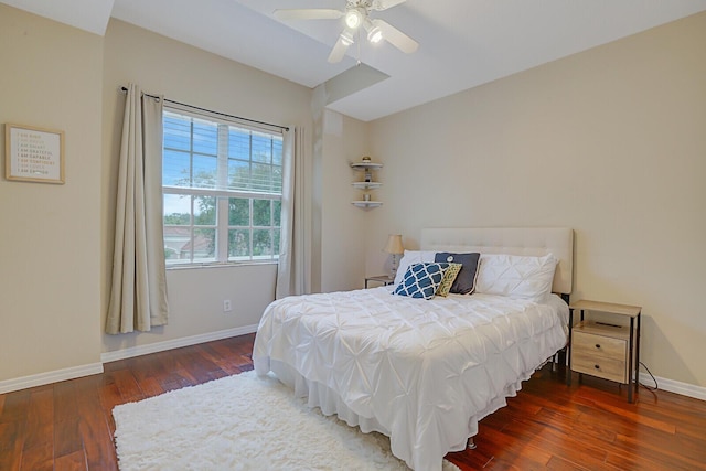 bedroom featuring ceiling fan and dark hardwood / wood-style floors