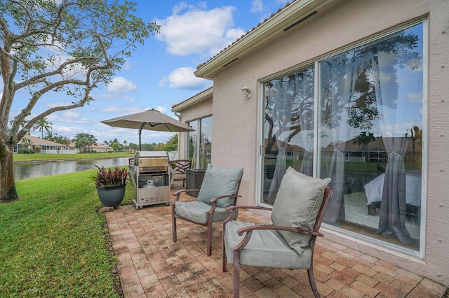 view of patio / terrace with a water view