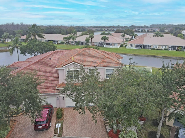 birds eye view of property with a water view