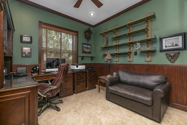 home office with ceiling fan, wood walls, and ornamental molding