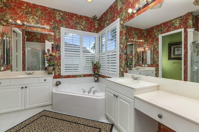 bathroom featuring tile patterned flooring, vanity, and shower with separate bathtub