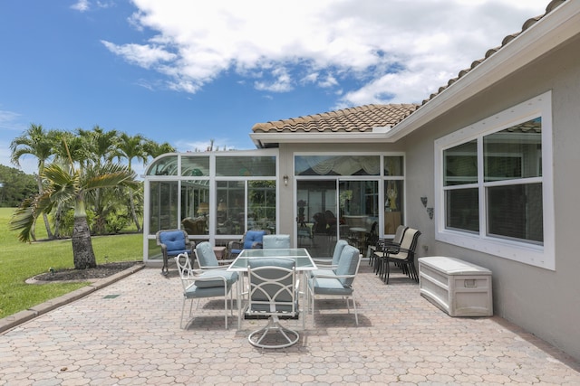 view of patio / terrace featuring glass enclosure