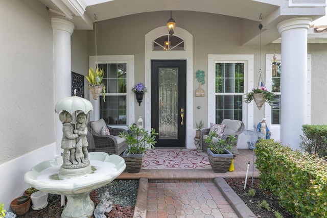 view of exterior entry featuring a porch