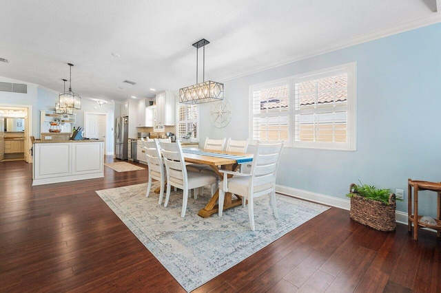 dining space featuring vaulted ceiling, dark wood-type flooring, and crown molding