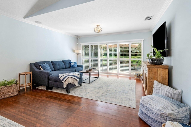 living room with a textured ceiling, dark hardwood / wood-style flooring, lofted ceiling, and ornamental molding