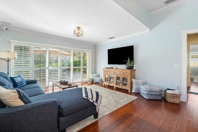 living room featuring dark hardwood / wood-style flooring and ornamental molding