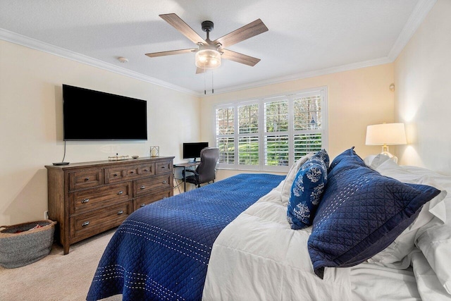 bedroom with ceiling fan, light colored carpet, ornamental molding, and a textured ceiling