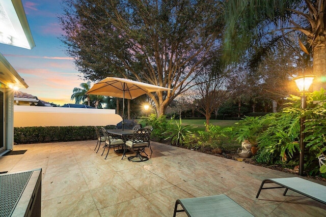 view of patio terrace at dusk