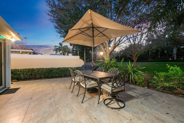 view of patio terrace at dusk