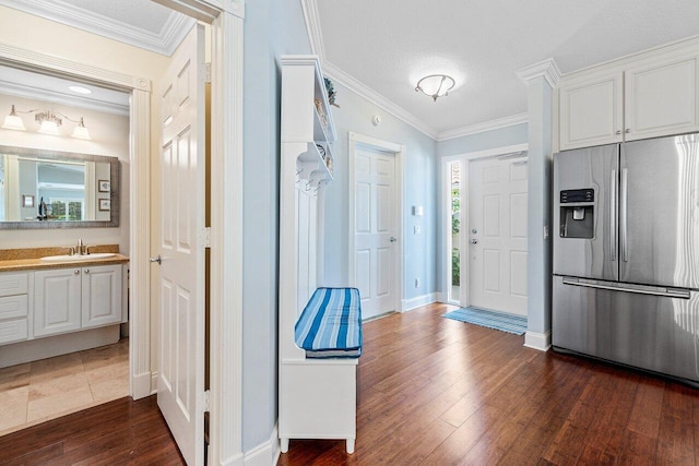 interior space with white cabinets, sink, dark hardwood / wood-style flooring, and stainless steel fridge with ice dispenser