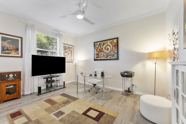 office area with ceiling fan, ornamental molding, and light wood-type flooring