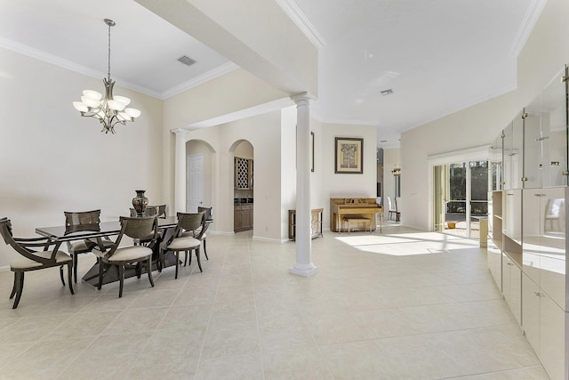 dining area with decorative columns, light tile patterned flooring, ornamental molding, and a chandelier