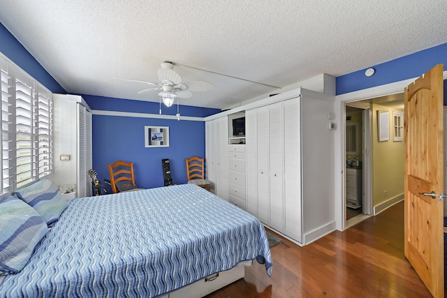 bedroom with ceiling fan, dark wood-type flooring, and a textured ceiling