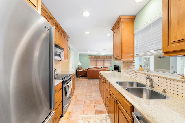 kitchen with stainless steel appliances, decorative backsplash, sink, ceiling fan, and light tile patterned floors