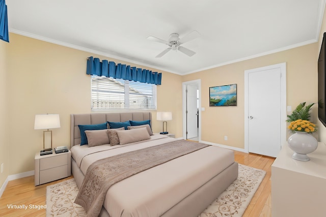 bedroom with ceiling fan, ornamental molding, and light hardwood / wood-style floors