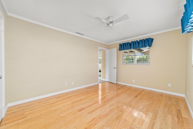 unfurnished room featuring ceiling fan, hardwood / wood-style floors, and crown molding