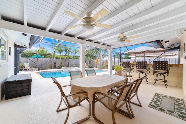 view of patio featuring ceiling fan, a swimming pool with hot tub, and glass enclosure