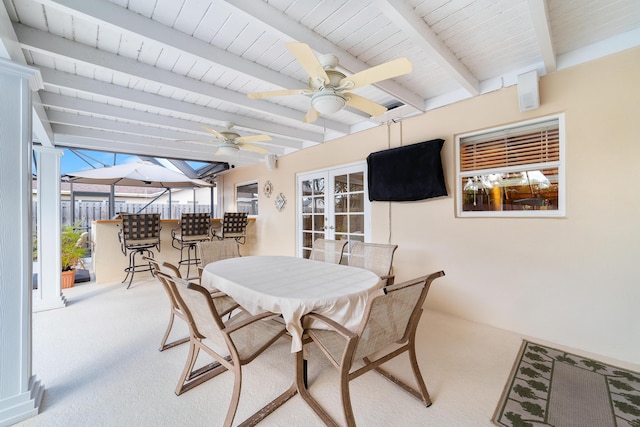 view of patio / terrace featuring ceiling fan, french doors, and exterior bar