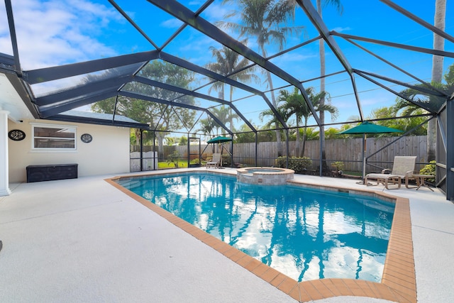 view of swimming pool featuring a lanai, an in ground hot tub, and a patio