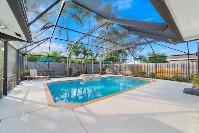 view of pool with a lanai, a patio, and an in ground hot tub