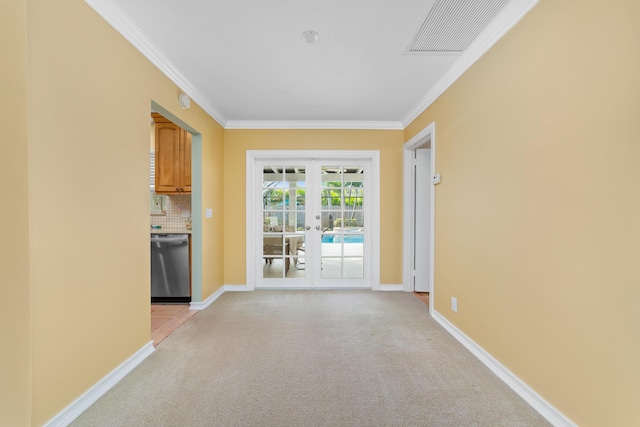 unfurnished living room with light carpet, crown molding, and french doors