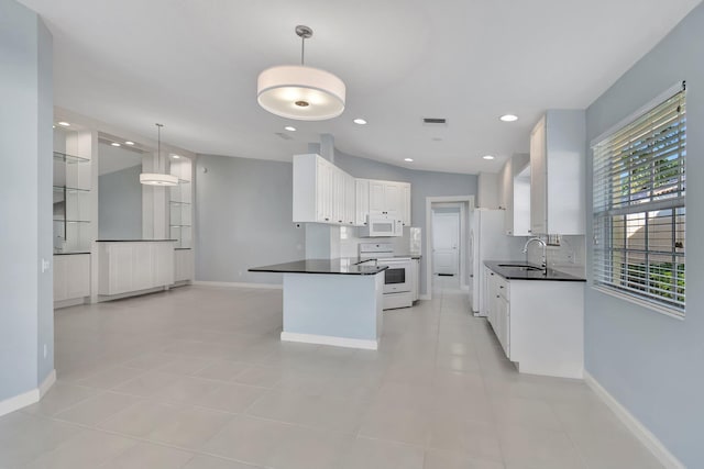 kitchen featuring sink, white appliances, light tile patterned floors, white cabinets, and decorative light fixtures