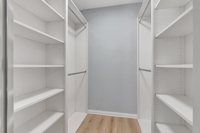 walk in closet featuring light hardwood / wood-style floors