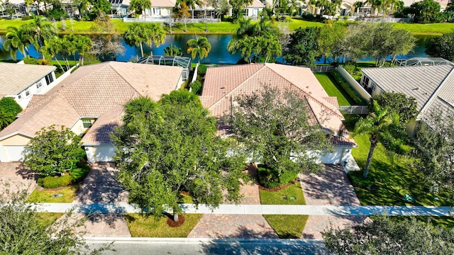 birds eye view of property with a water view