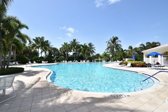 view of swimming pool with a patio area