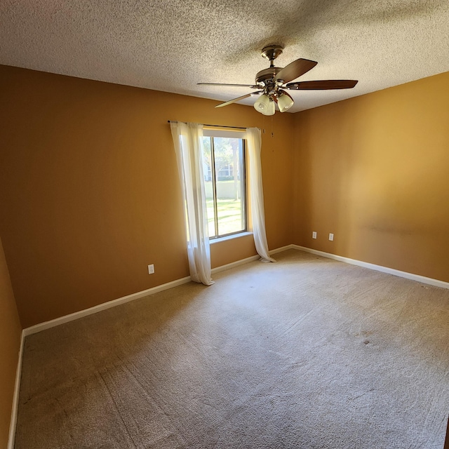 unfurnished room featuring a textured ceiling, ceiling fan, and carpet