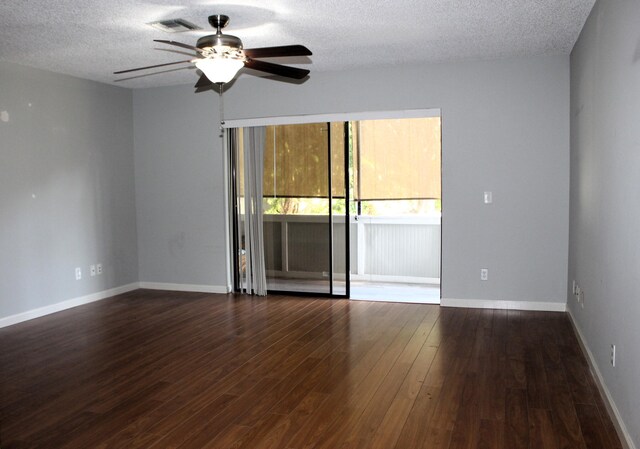 800 NW Fork Rd Unit 2-3, Stuart, FL 34994 - unfurnished room with baseboards, a ceiling fan, wood finished floors, and a textured ceiling