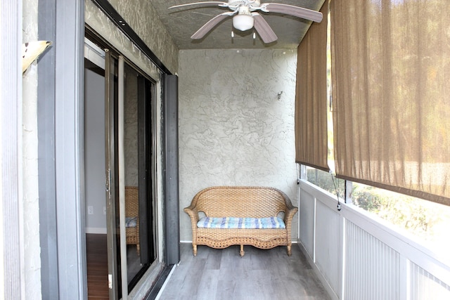 sunroom / solarium with ceiling fan