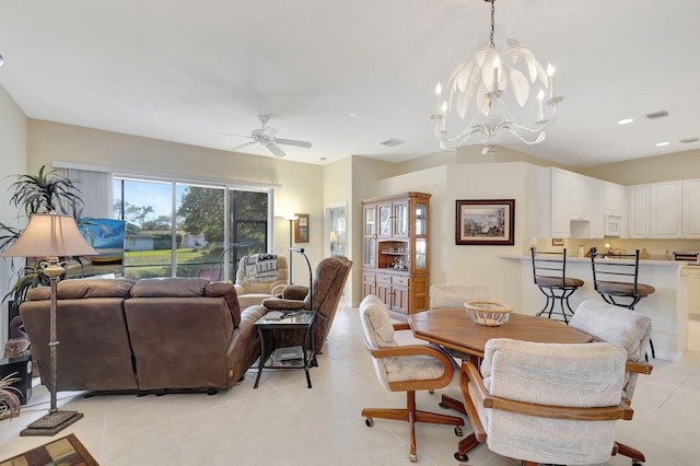 dining space with ceiling fan with notable chandelier