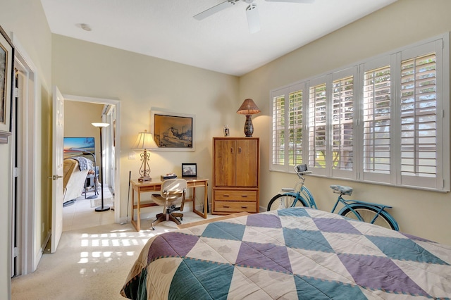 carpeted bedroom featuring a closet and ceiling fan