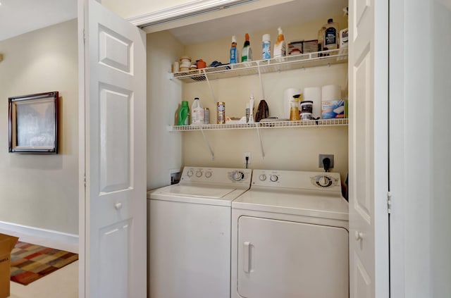 clothes washing area featuring washing machine and clothes dryer