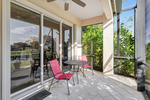 sunroom / solarium with ceiling fan