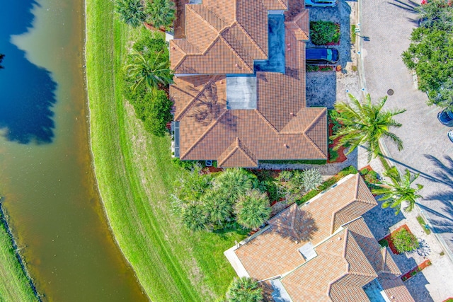 birds eye view of property featuring a water view