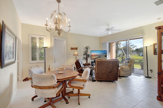 dining area featuring ceiling fan with notable chandelier and light tile patterned floors