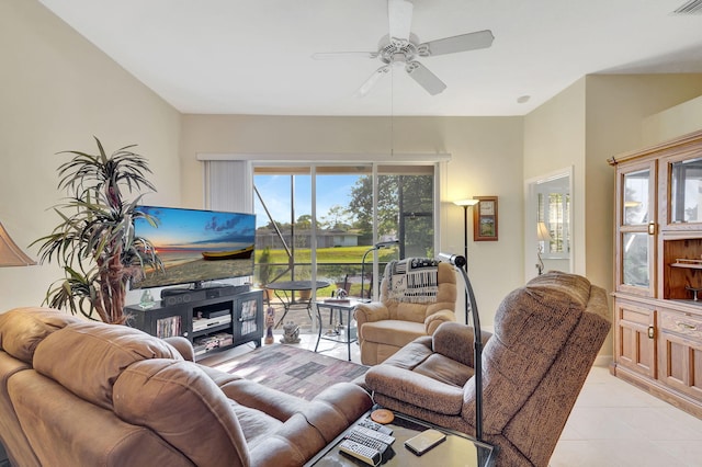 tiled living room with ceiling fan