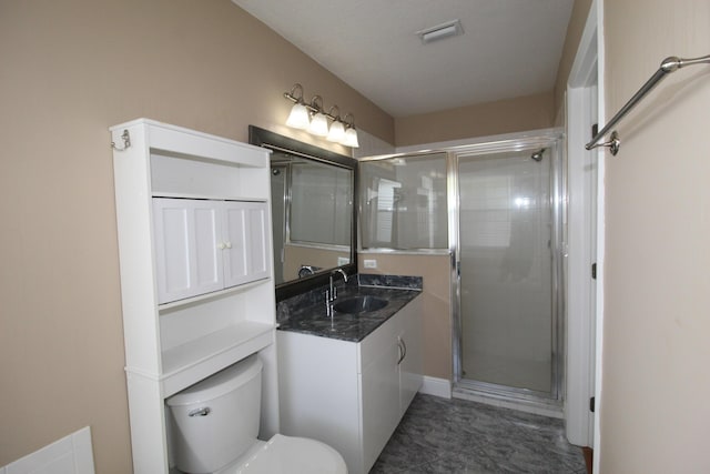 bathroom featuring toilet, a shower stall, visible vents, and vanity