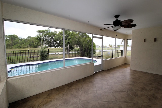 view of swimming pool featuring fence, a ceiling fan, and a fenced in pool