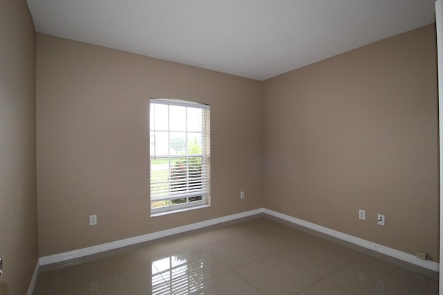 tiled spare room with baseboards