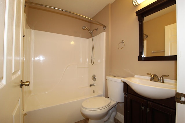 bathroom with tub / shower combination, vanity, and toilet